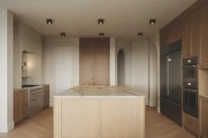 Oak and marble kitchen with island and pendant lights